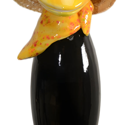 Raven with and straw hat and yellow scarf from Goose and Company