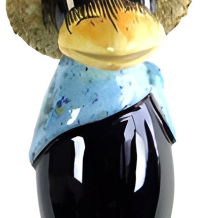 Raven with and straw hat and light blue scarf from Goose and Company