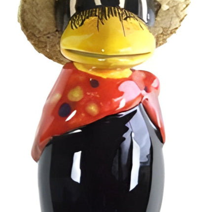 Raven with and straw hat and red base scarf with polka dots from Goose and Company