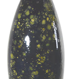 Decorative cat-shaped object with black and green speckled body, red ears, and white face on a white background.