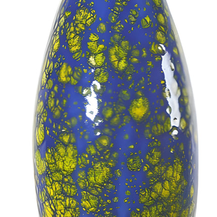 Colorful cat-shaped object with blue body and yellow spots on a white background from Goose and Company