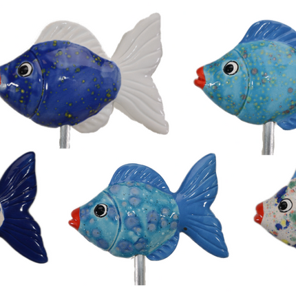 Five decorative fish figures on sticks with blue and white patterns.